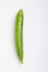 Fresh green sponge gourd or luffa on white background