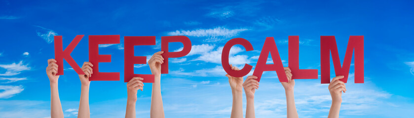 People Hands Holding Colorful English Word Keep Calm. Blue Sky As Background
