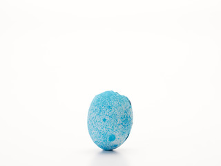 Easter egg cracked open on white.