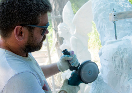 Sculptor at work. Stone carving.