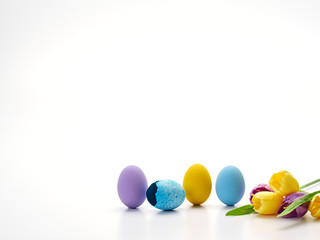Colorful Easter eggs and tulips.