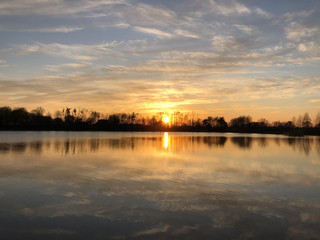 Fototapeta na wymiar Sunset reflection in a lake around Zelhem