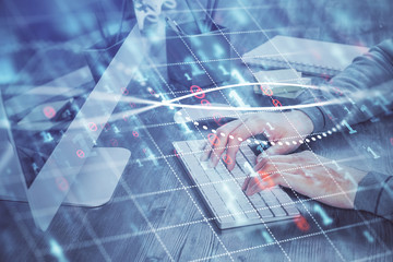 Double exposure of financial graph with man works in office on background. Concept of analysis.