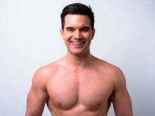 Fototapeta premium Face of happy young handsome muscular man smiling shirtless