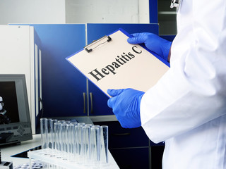 Hepatitis C illness diagnosis in the medic hands.