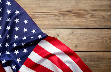 Fototapeta na wymiar American flag on grey wooden background with copy space