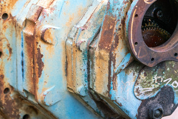 Old rusty and destroyed gearbox used in offshore, oil and marine industry.