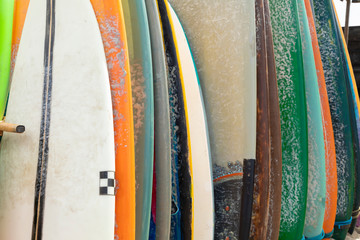 Texture of surfboards, covered in paraffin, stored waiting for a surfer on the beach of Canggu, south of Bali, Indonesia, on a hot August day.