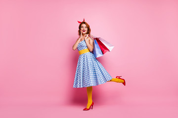 Full size photo cute sweet fancy girl tourist shopping center client enjoy off-sales bargain scream hold bags wear blue red high-heels headband yellow stockings isolated pink color background