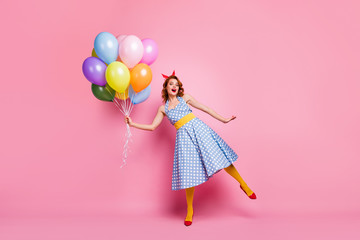 Full size photo of crazy pretty childish trend girl enjoy positive cheerful walk weekend hold air balls baloons wear stockings red shoes isolated over pink color background