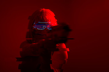 Girl with blaster in the futuristic battle. Concept virtual reality, cyber game. Image with glitch...