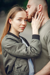 Couple in a forest. Man in a green t-shirt