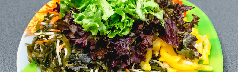 Ingredients for making salad on a green plate. © bearok