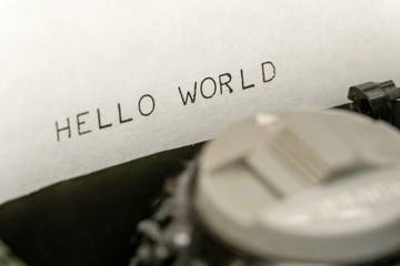 Close up printed text Hello World on an old typewriter