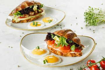 croissant with salmon and eggs