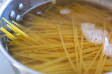 Spaghetti pasta boiling in a pot