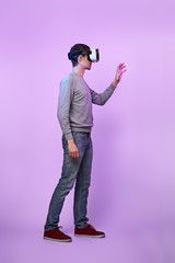 Naklejka premium Man is using virtual reality headset.