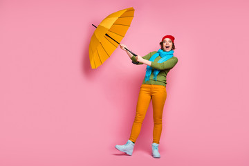 Full body photo excited girl travel trip her shine umbrella fly wind air she try catch scream wow...