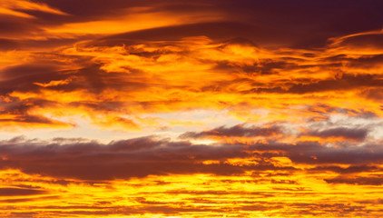 Colorful clouds at sunrise. Sky burning and glowing. Background