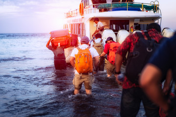 Traveler getting in the line for fast boat to Nusa Penida Island,Indonesia.