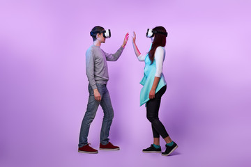 Fototapeta na wymiar Couple in love communicate using a virtual reality headset.