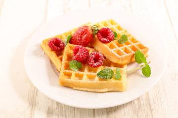 waffle cake with raspberry in plate