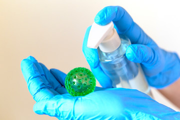 Holding virus in medical gloves and sanitizing virus. Sanitizer against covid-19