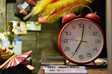 Red clock with blur background detail
