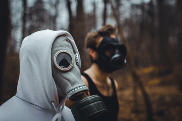 Man in mask / gas mask in the forest