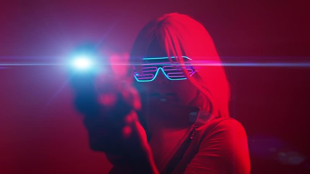 Girl with blaster in the futuristic battle. Concept virtual reality, cyber game.