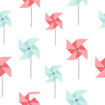 Paper windmill seamless pattern. Perfect as a baby shower or children's birthday decoration. Blue and pink paper windmill decorated with dots.