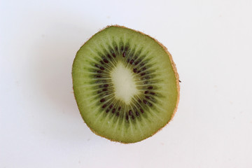 slice of kiwi on white background