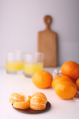 tangerine and tangerine juice in a bright kitchen