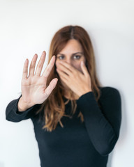 Women's hands as a signal to stop or refuse. Concept of stopping violence or abuse against women.