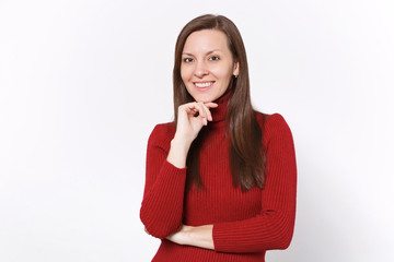 Smiling attractive young brunette woman girl in casual red clothes posing isolated on white wall background studio portrait. People lifestyle concept. Mock up copy space. Put hand prop up on chin.