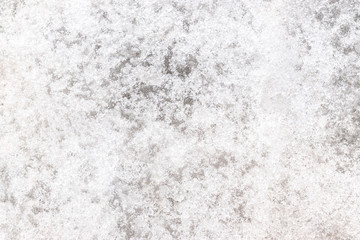 A loose melted ice on the surface of water close up.Abstract background,creative texture.Copy space,top view