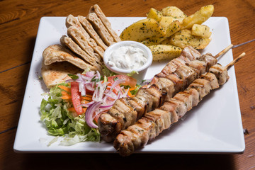 Grilled chicken meat on skewer