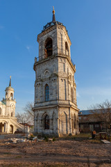 The bell tower of the Church of the Vladimir Icon of the Mother of God against a clear blue sky