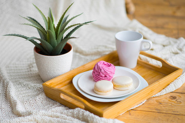 still life baked macaroons in a wooden tray