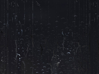 Abstract dark gray background. Shiny drips on a dark backdrop.