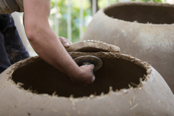 Man making term tandoor in Uzbekistan