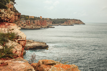 picturesque rough coastline on a cloudy day near Santanyi, Mallorca, Spain