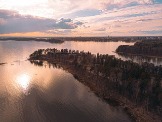 Helsinki islands. Scandinavian sea landscape. Beautiful sunset with reflection of clouds in the sea Aerial top down drone shot.