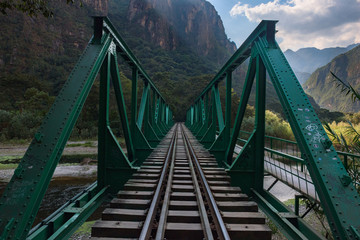 Green railway bridge along the Salkantay Trek near Aguas Calientes, Peru