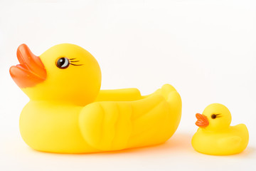 Yellow inflatable duck toy with a little duckling. Isolated on a white background.