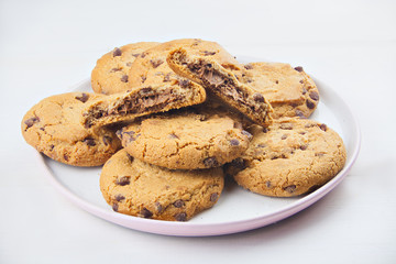 delicious appetizing cookies with chocolate on plate