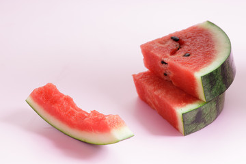 Pieces of fresh Watermelon on pink background