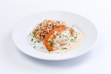 cutlet with buckwheat on the white background