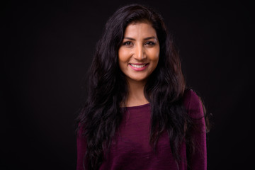 Fototapeta premium Face of happy young beautiful Indian woman smiling