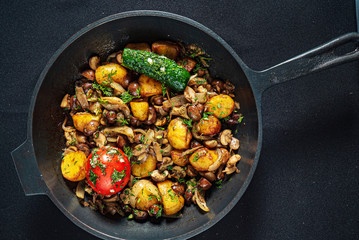 roasted potatoes with meat and vegetables
